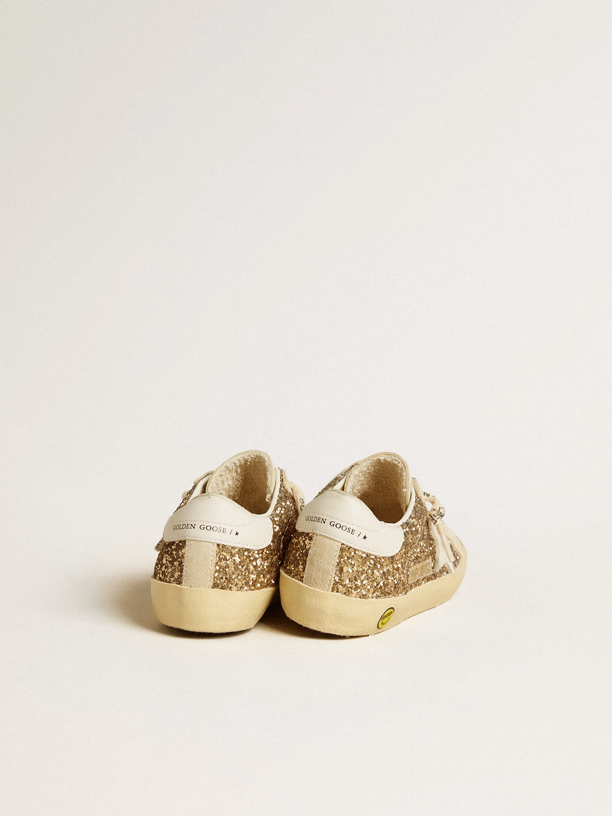Super-Star Junior in gold glitter with white leather star and heel tab