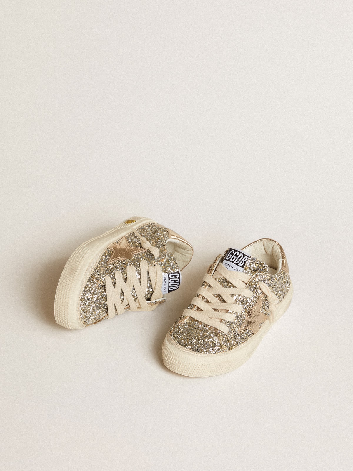 May Junior in platinum glitter with metallic leather star and heel tab