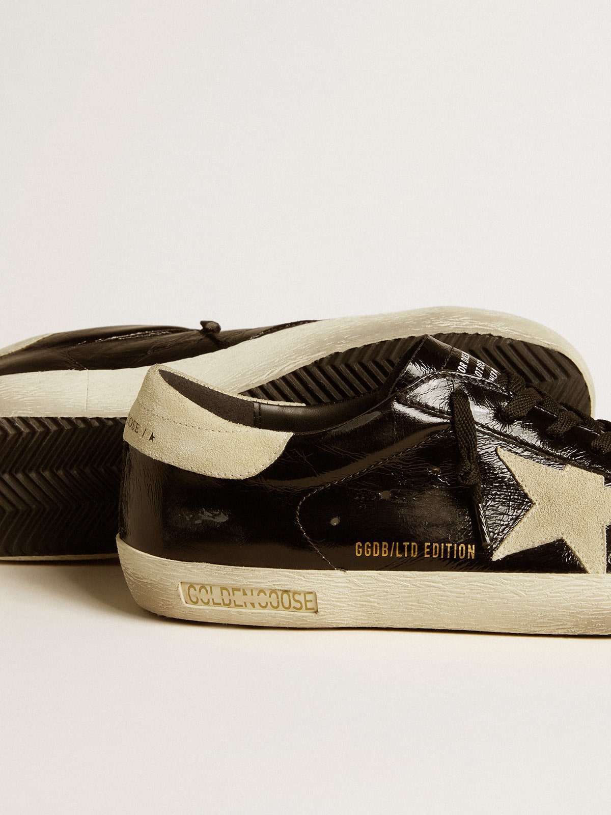 Men's Super-Star LTD in black patent leather with suede star and heel tab