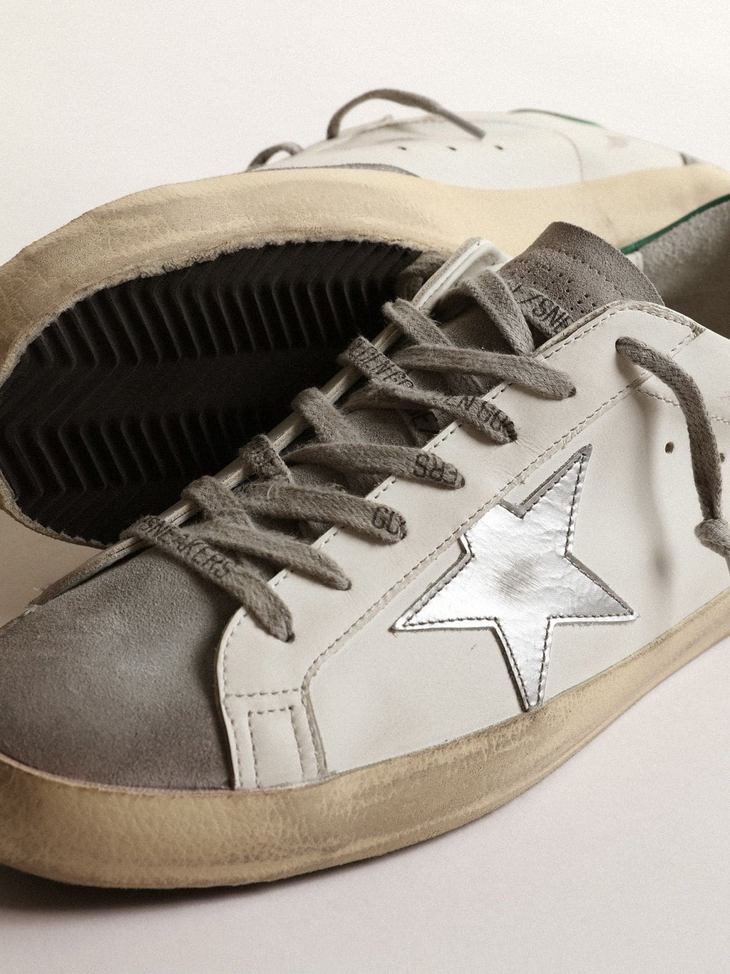 Men's Super-Star in white leather with silver star and green heel tab