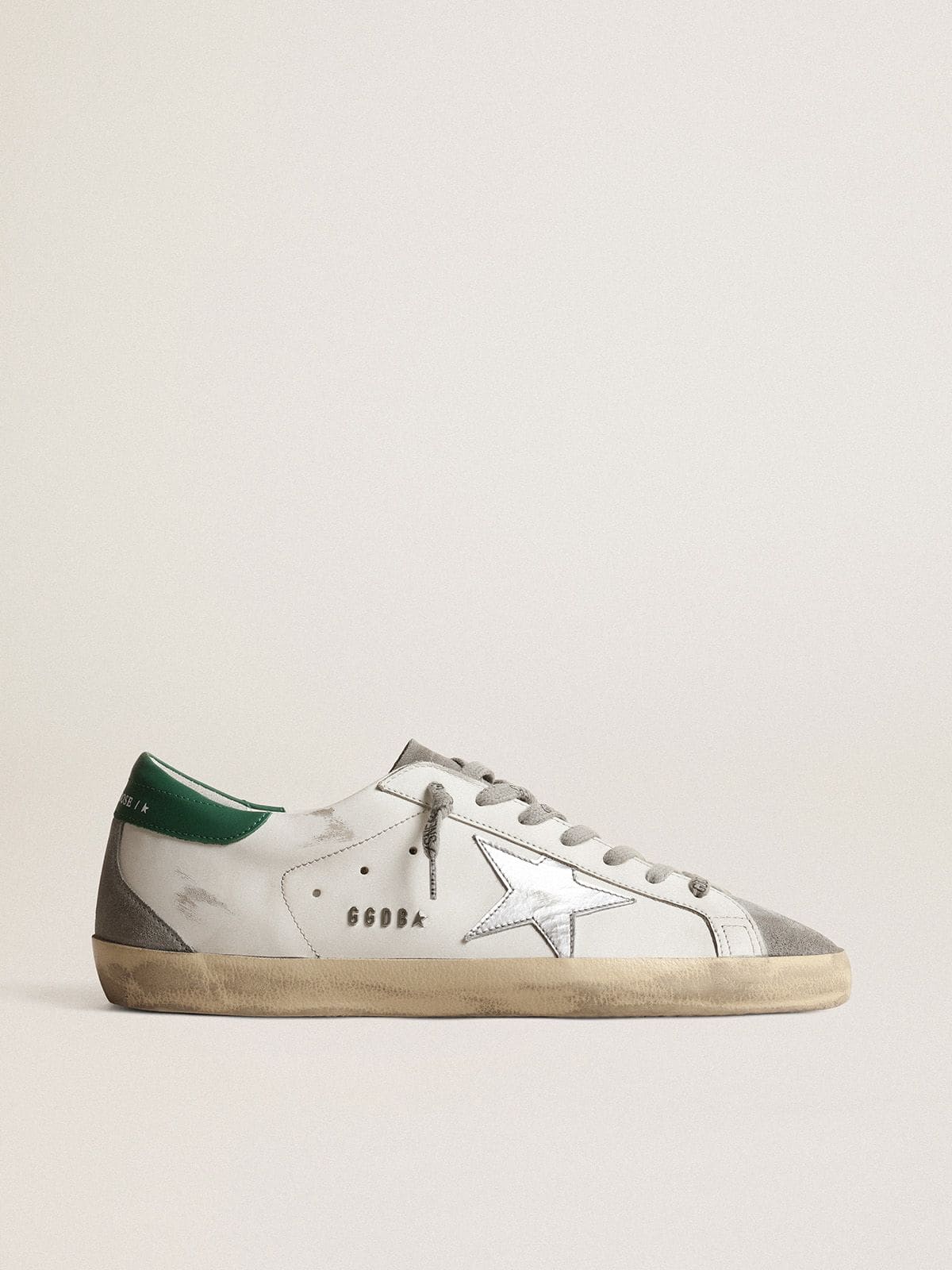 Men's Super-Star in white leather with silver star and green heel tab