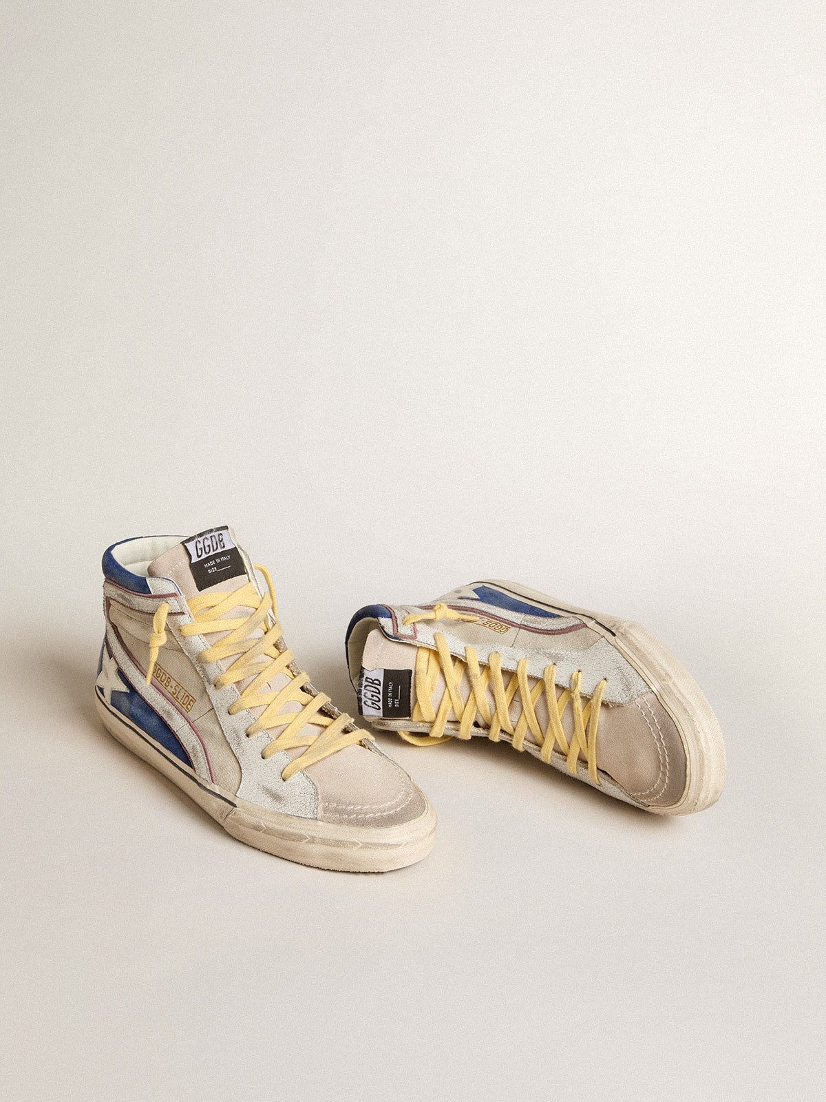 Slide in pearl canvas and blue suede with white leather star and flash