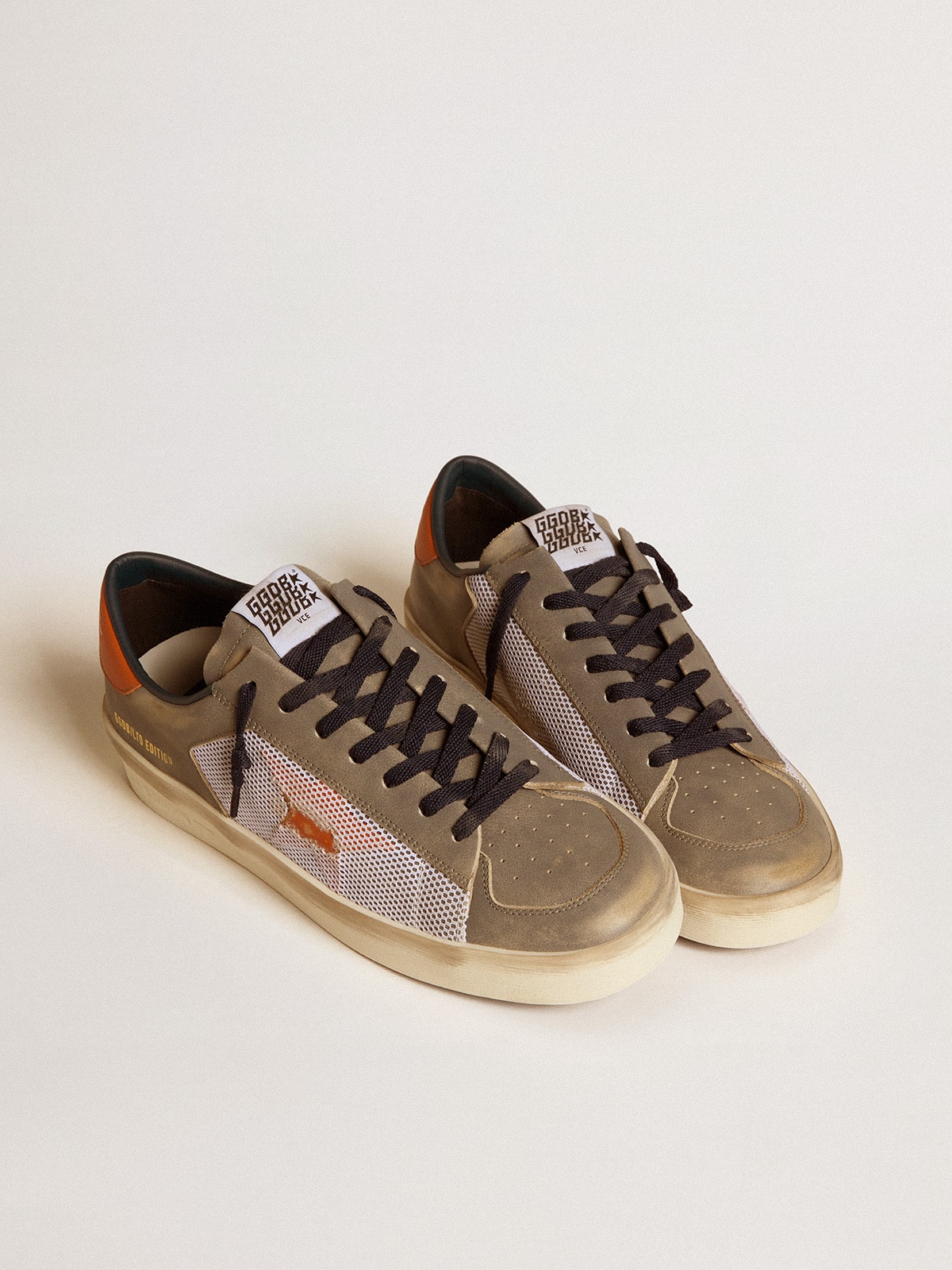 Stardan LTD in gray leather and mesh with leather star and heel tab