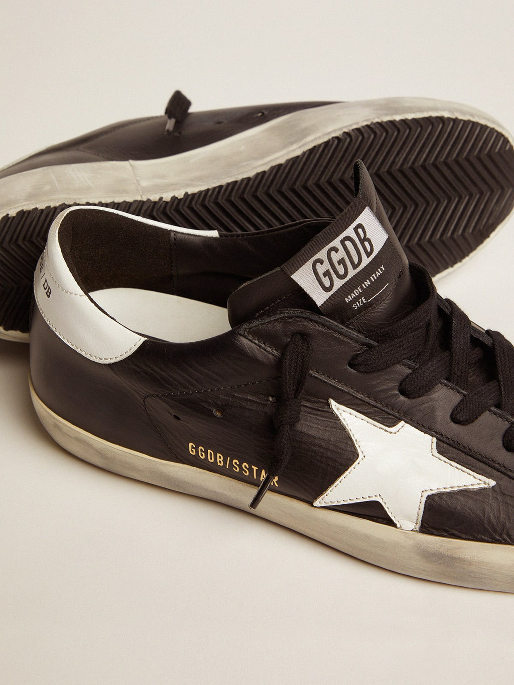Women's Super-Star in black leather with white leather star and heel tab