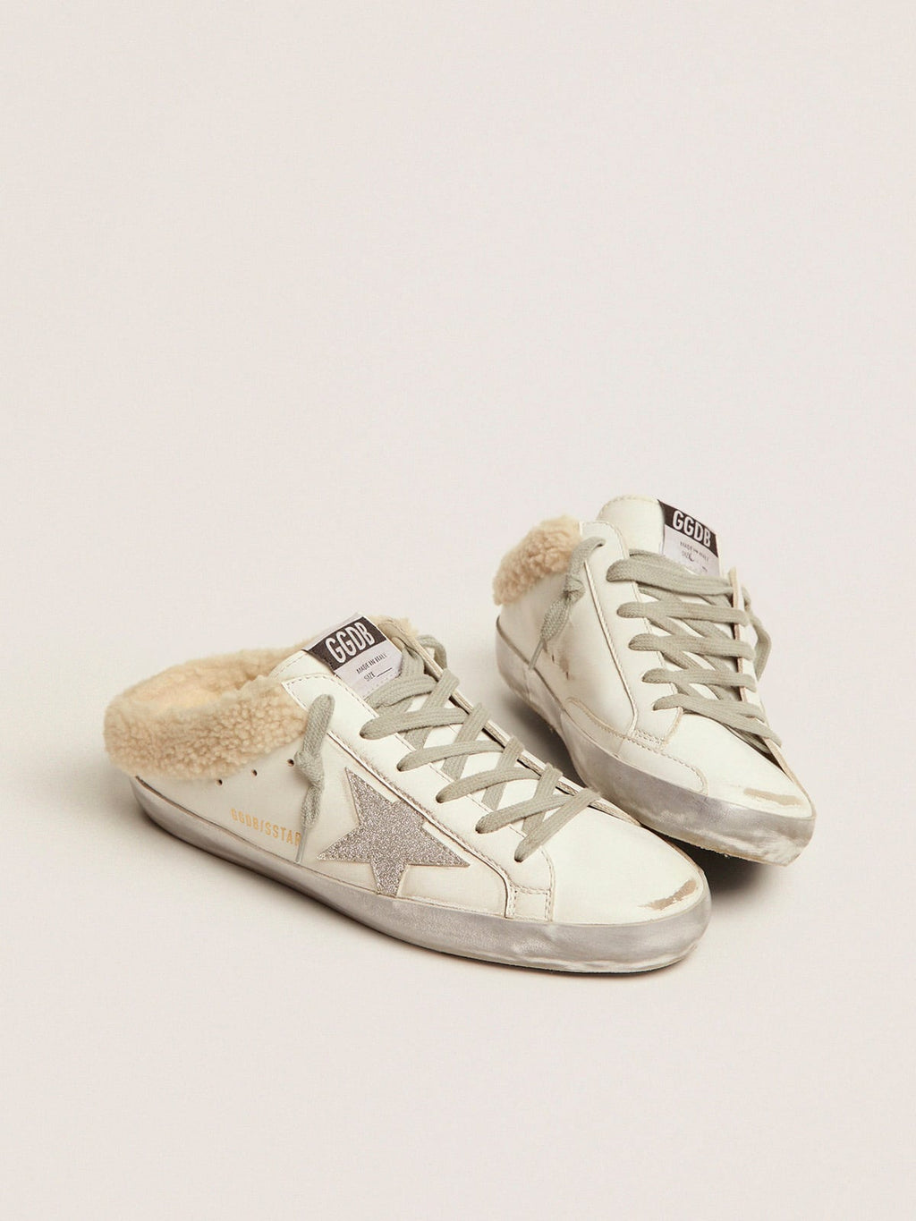 Super-Star Sabots in white leather with shearling lining