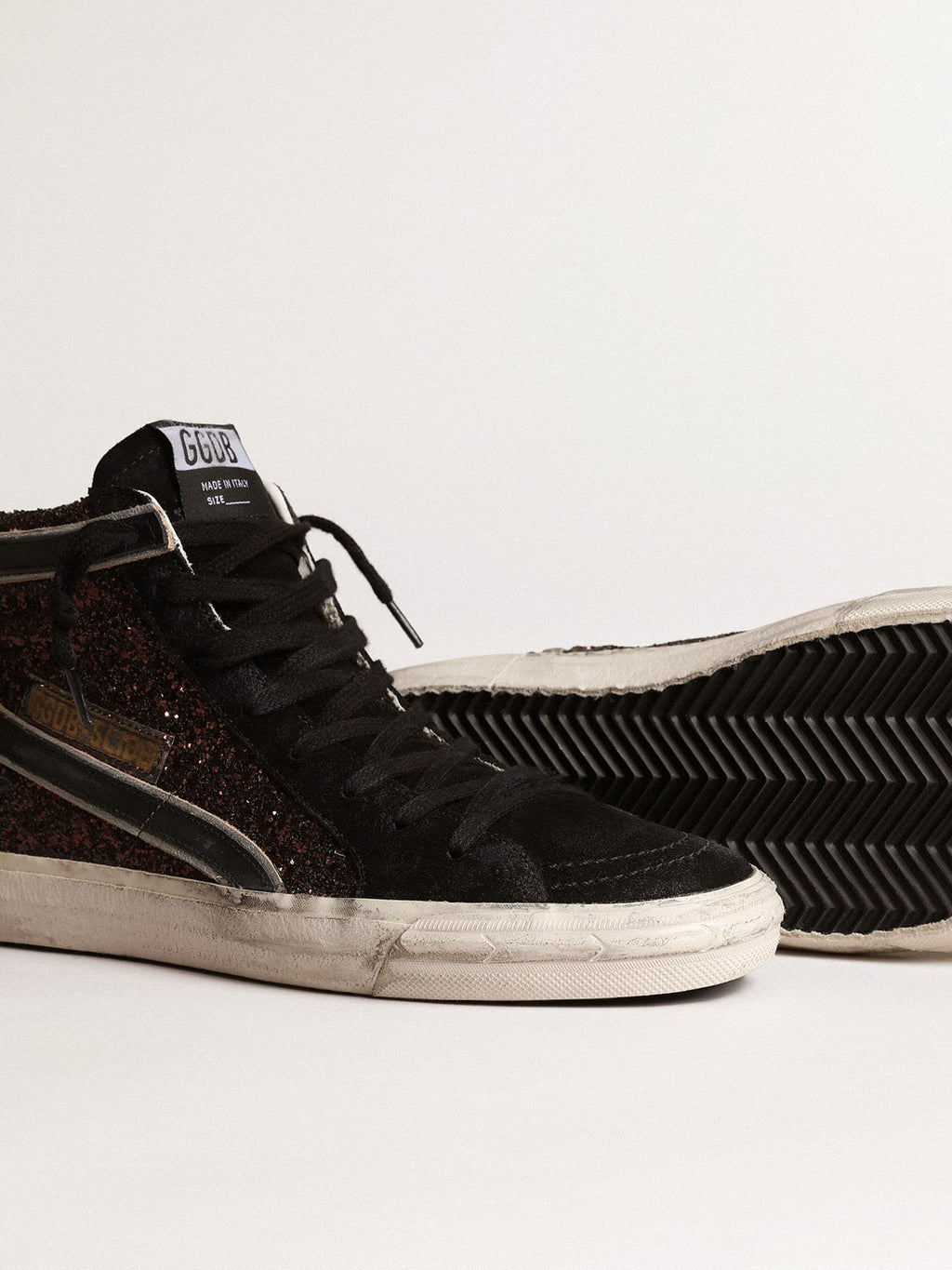 Slide in brown glitter with black leather star and flash