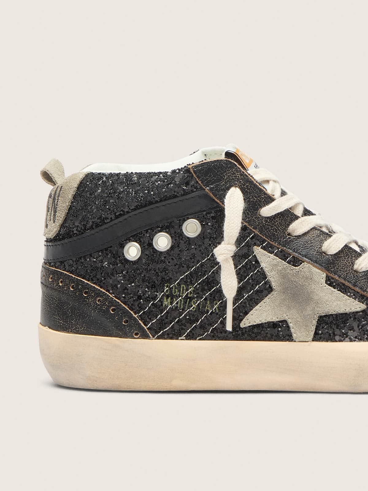 Women's Mid Star in black glitter with dove-gray suede star and heel tab