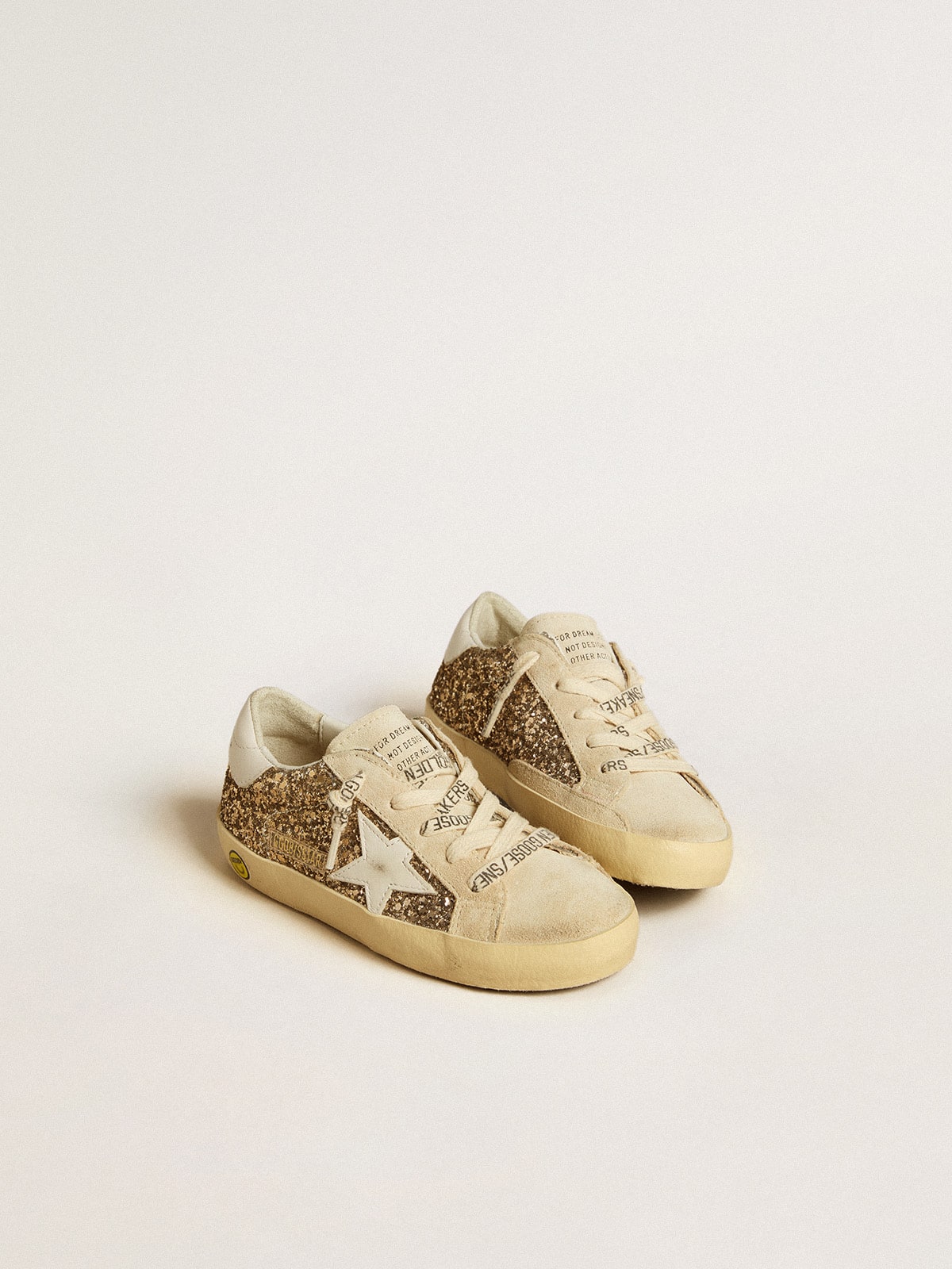 Super-Star Young in gold glitter with white leather star and heel tab