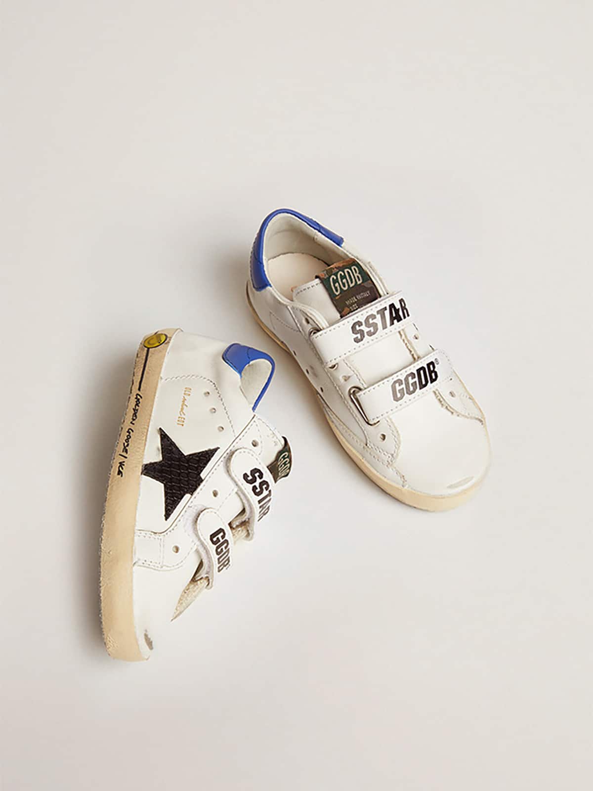 Young Old School with black snake print leather star and blue heel