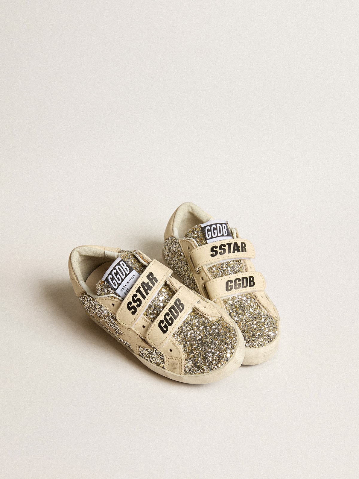 Old School Young in platinum glitter with leather star and heel tab