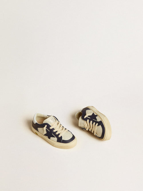 May Young in white and blue leather with leather star and heel tab